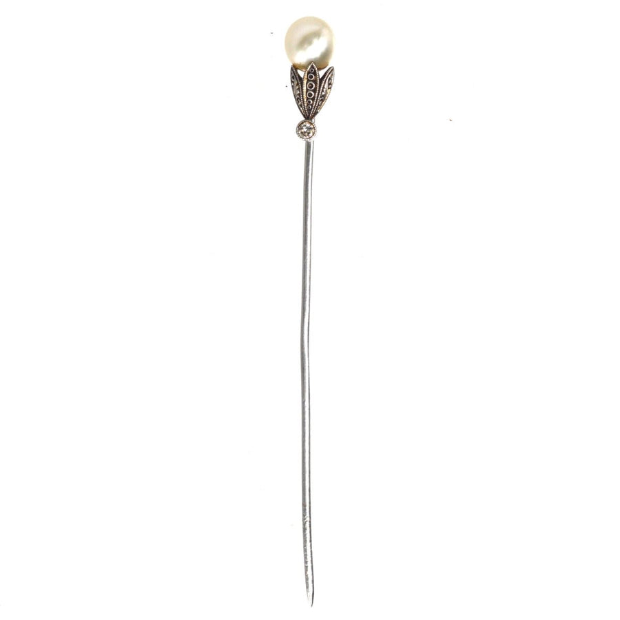 Edwardian platinum tie pin featuring natural pearl and diamond, beautifully engraved petals, elegant accessory for silk ties.