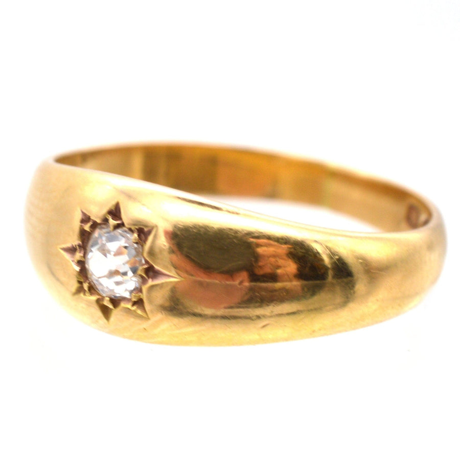 Edwardian 18ct gold gypsy ring featuring a 0.18 carat old mine cut diamond in a star setting.