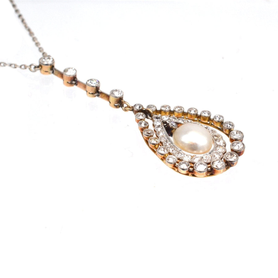 Edwardian pendant necklace featuring a natural saltwater pearl surrounded by sparkling diamonds.