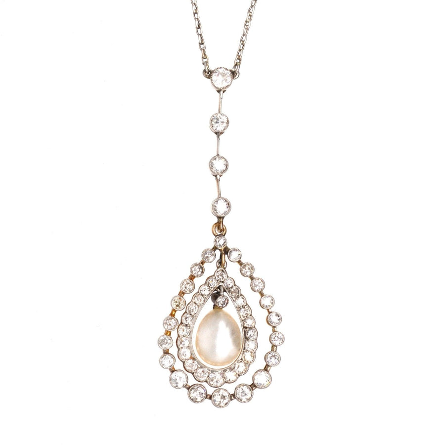 Edwardian platinum and gold necklace featuring a diamond-encrusted pendant with a natural saltwater pearl.