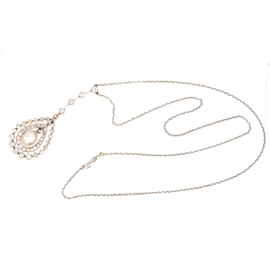 Edwardian platinum and gold diamond pendant necklace featuring natural saltwater pearl.