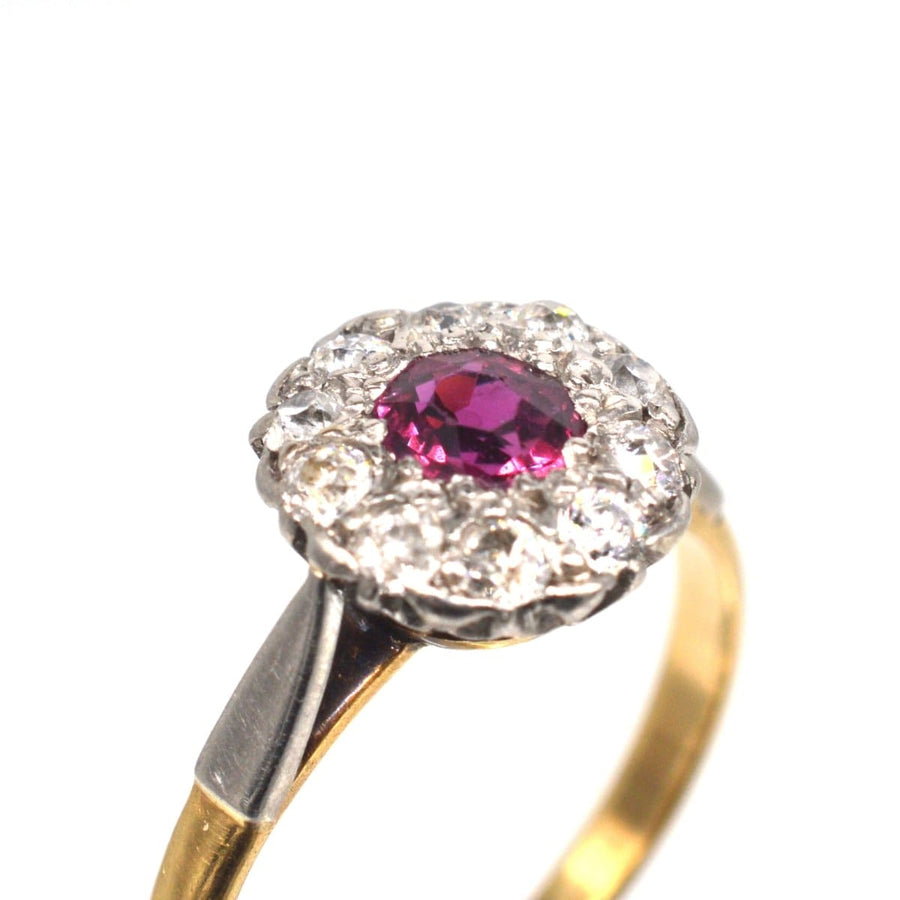 Edwardian platinum and 18ct gold ruby and diamond cluster ring with a stunning natural ruby centerpiece.