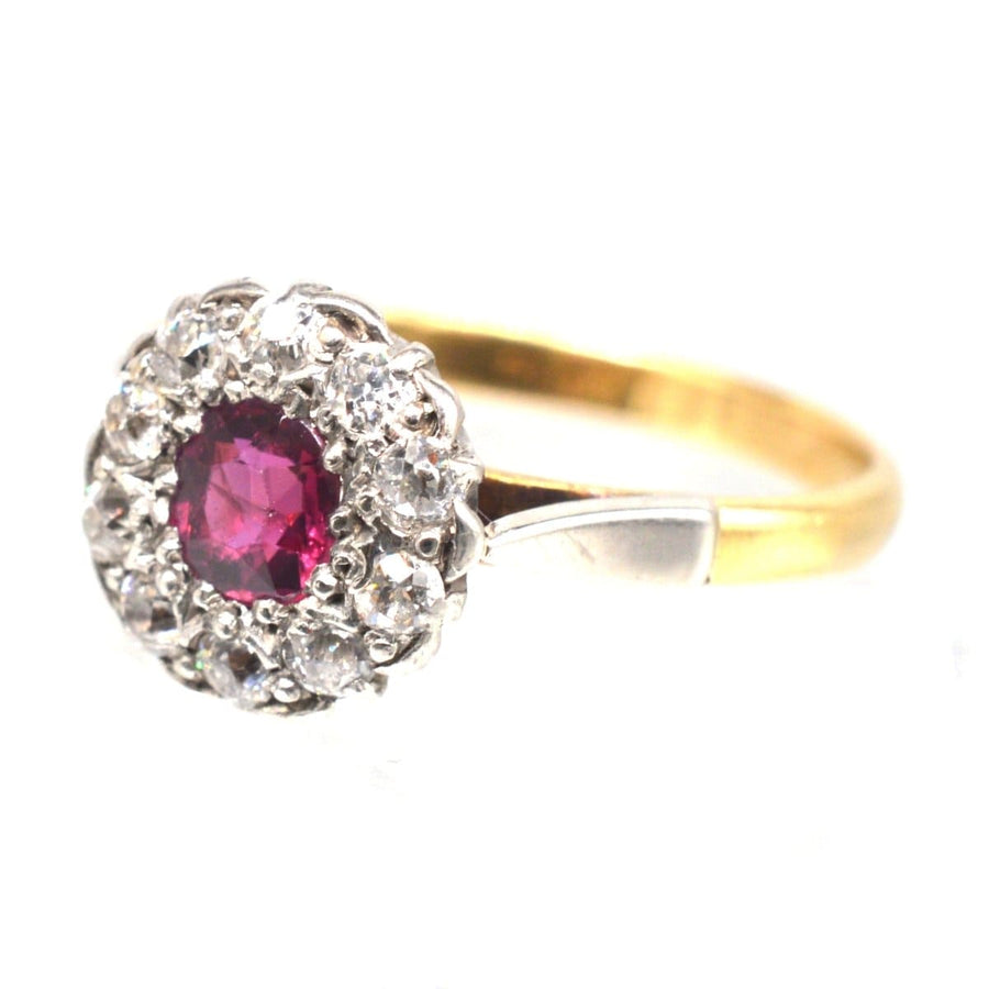 Edwardian platinum and gold ruby diamond cluster ring with natural ruby and diamond accents.