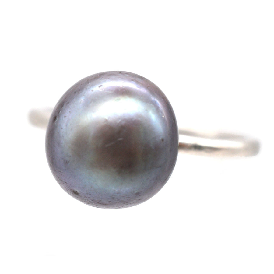 Edwardian platinum ring featuring a certified natural black saltwater pearl, showcasing exquisite craftsmanship and elegance.