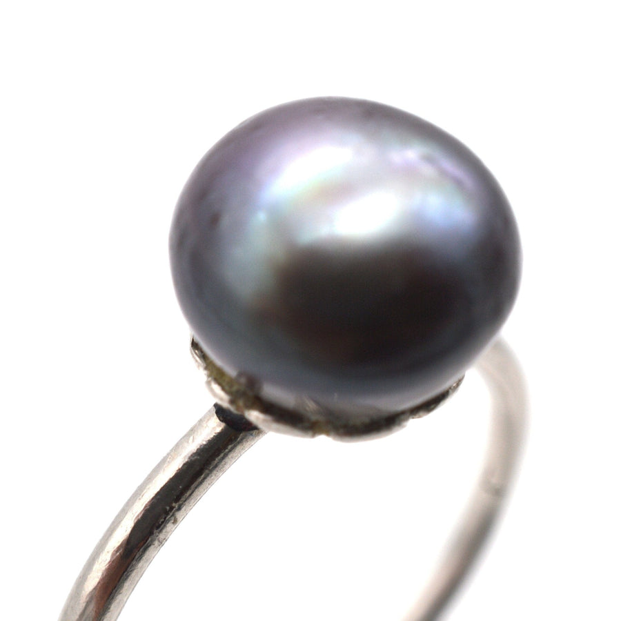 Edwardian platinum ring featuring a certified natural black saltwater pearl, a stylish fine jewelry piece.