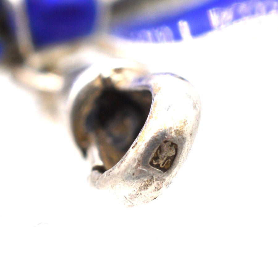 Close-up of the silver dog clip on an Edwardian royal blue guilloché enamel brooch, showcasing intricate details.