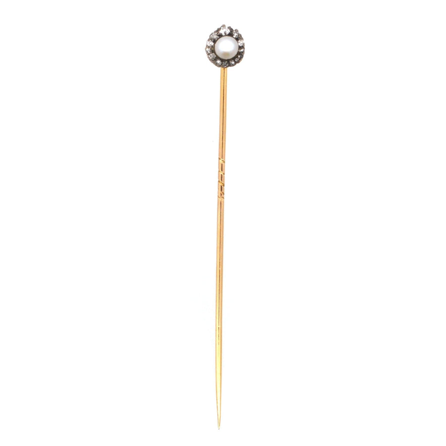 Edwardian tie pin featuring a pearl and old mine cut diamonds, showcasing vintage craftsmanship and elegance.