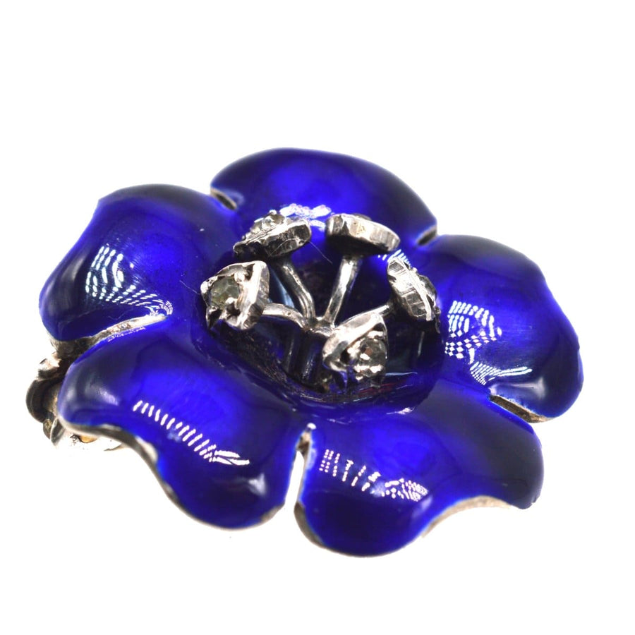 Edwardian silver brooch with cobalt blue enamel flower and white paste stamens, perfect for lapel or hat.