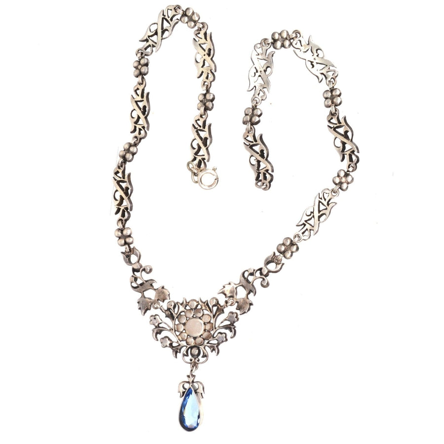 Edwardian silver necklace with blue aquamarine paste and diamond cluster centerpiece, perfect for weddings and evening parties.
