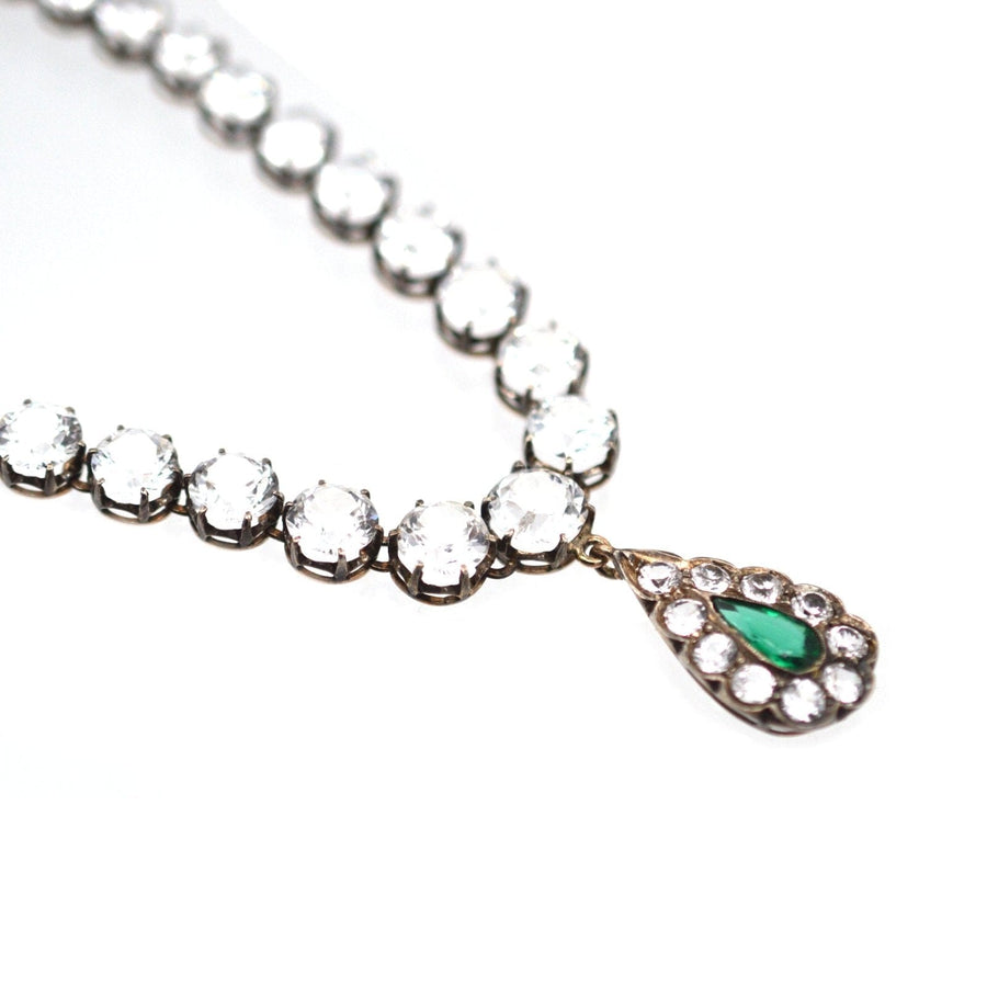 Edwardian white and green "Emerald" paste necklace featuring a sparkling riviere design and emerald drop detail.