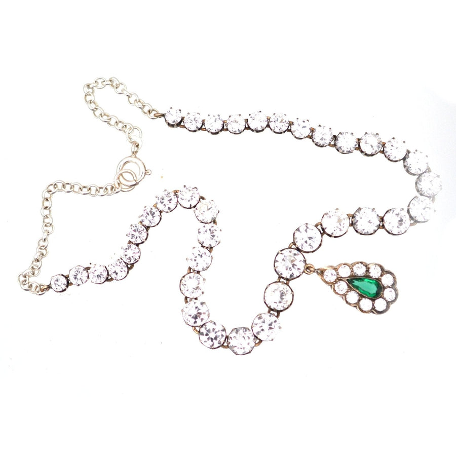 Edwardian white and green emerald paste necklace, featuring a silver riviere design with a dramatic drop.