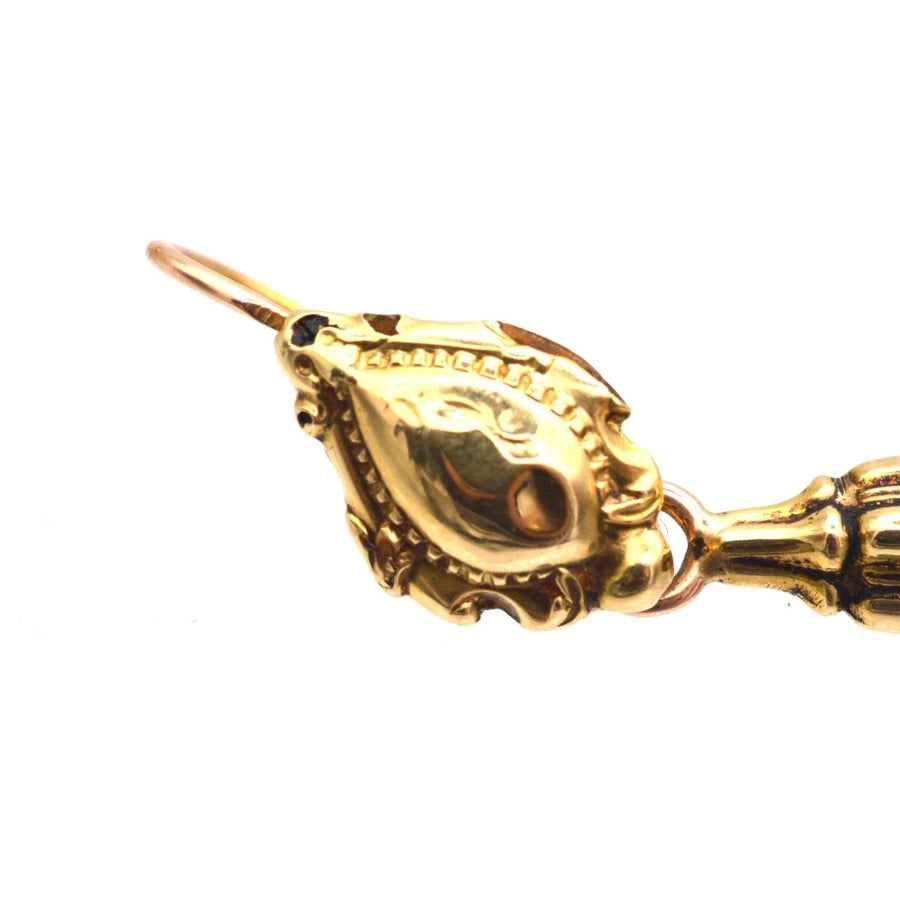 Close-up of 19th Century 18ct gold 'Night And Day' drop earring detailing, showcasing intricate design and craftsmanship.