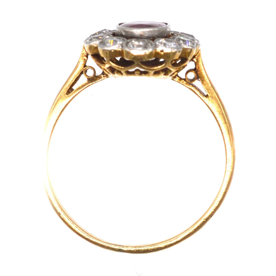 French Belle Epoque cluster ring featuring unheated Burma ruby and diamond halo, low-set design, elegant craftsmanship.