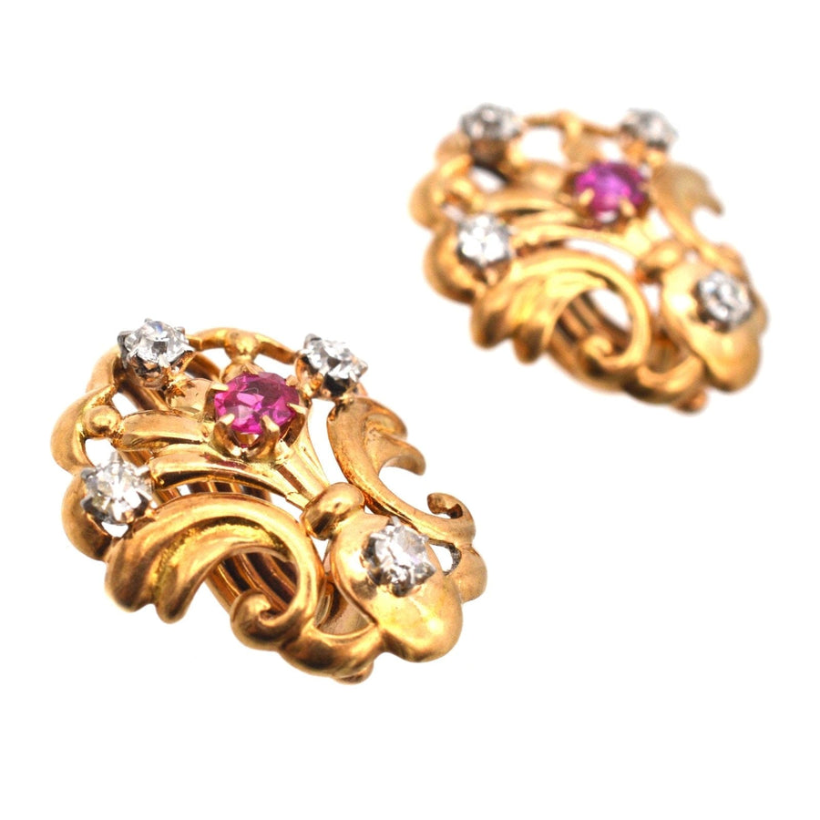 French Belle Époque 18ct gold earrings featuring ruby and diamond accents in a scallop shell design.