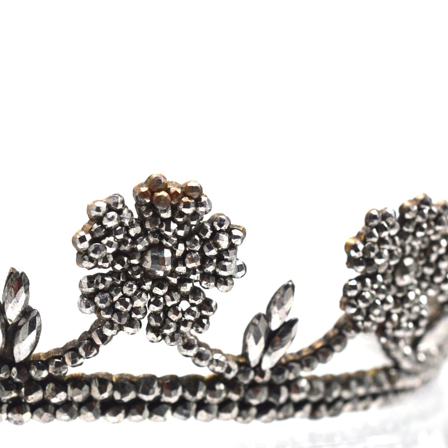 Georgian cut steel tiara featuring intricate wild rose blooms and swagged garland, showcasing exquisite craftsmanship.