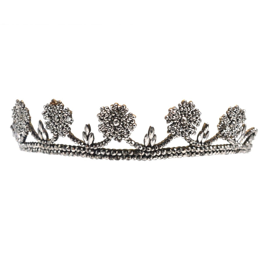 Georgian cut steel tiara featuring five wild rose blooms atop a garland, showcasing intricate 19th-century craftsmanship.