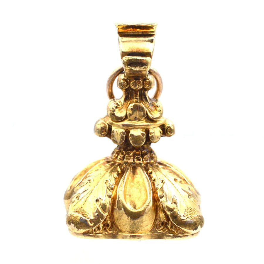 Late Georgian gold cased decorative seal with intricate feather details and monogram initials WCC, circa 1820.
