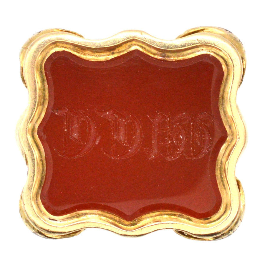 Georgian gold cased carnelian seal featuring engraved Gothick initials WCC, decorative and elegant design.