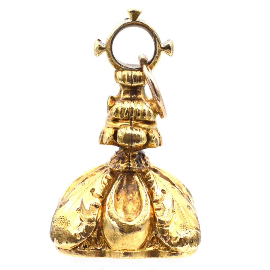 Georgian gold cased seal with intricate feather details and WCC monogram, perfect for jewelry or display.