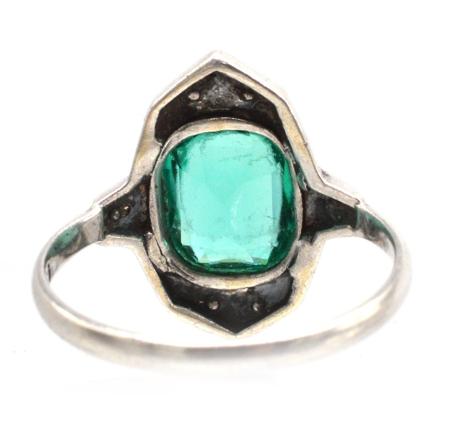 German Art Deco silver cocktail ring featuring emerald green paste stone and black enamel accents.