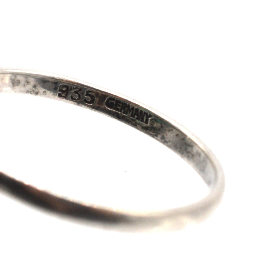 Close-up of the interior of a German silver ring, showing '935 Germany' engraving indicating high-quality craftsmanship.
