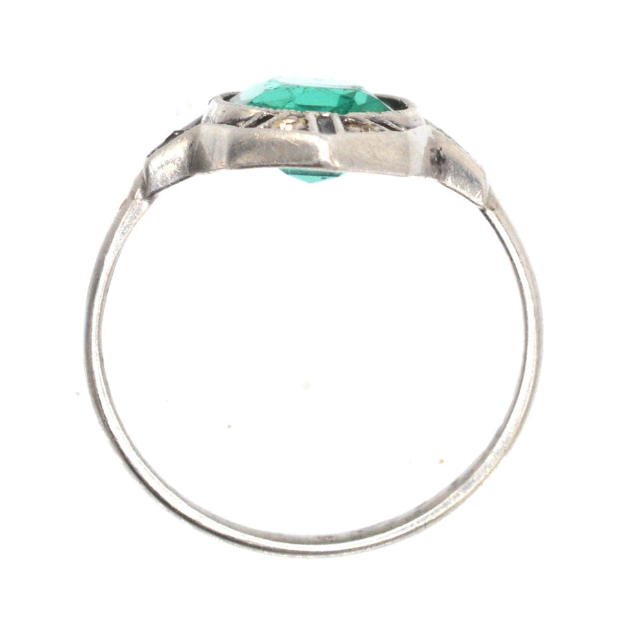 German Art Deco silver cocktail ring featuring emerald green and white diamond paste with black enamel onyx detailing.