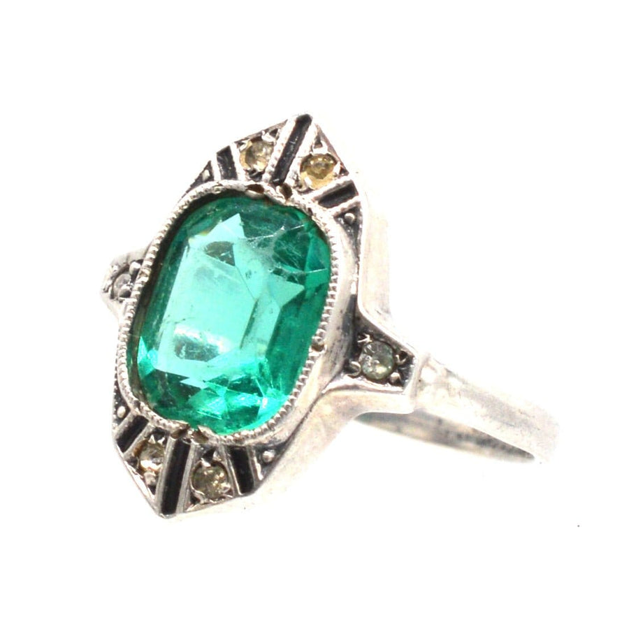 German Art Deco silver ring with emerald green paste stone and decorative white diamond paste accents.