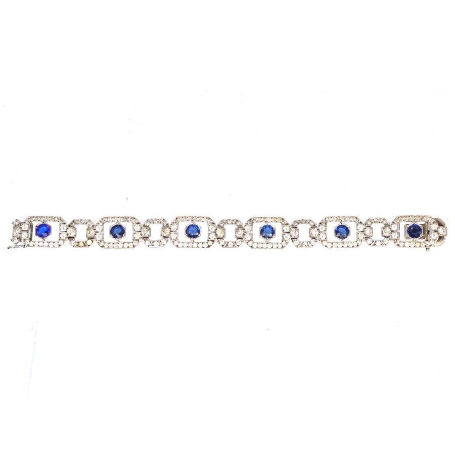 Art Deco silver bracelet featuring blue 'sapphire' and white paste stones by Knoll & Pregizer.