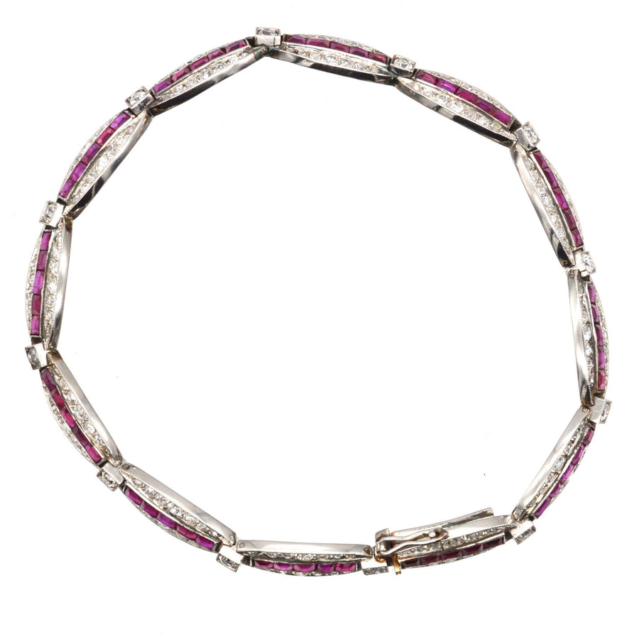 Antique 1910s gold and platinum bracelet with Burma rubies and old European cut diamonds.