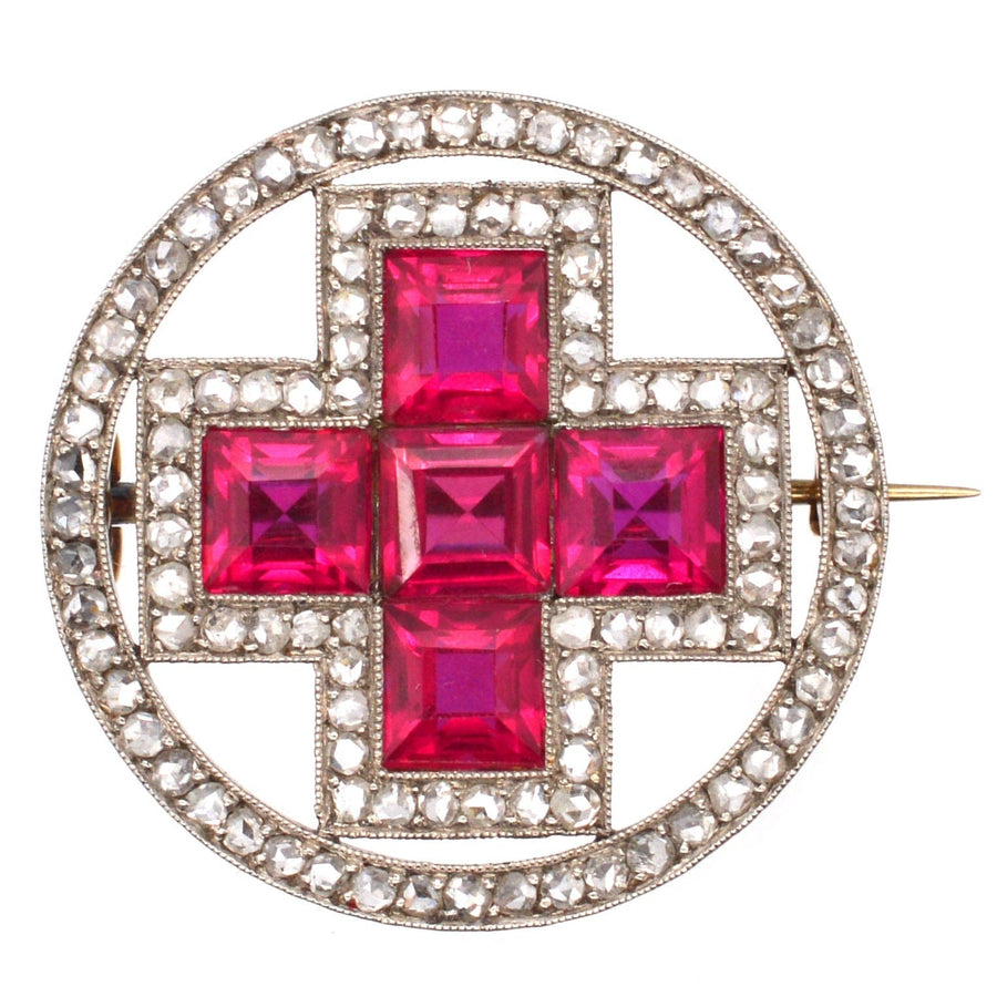 Red Russian Cross brooch with synthetic rubies and diamonds, showcasing early 20th-century craftsmanship.