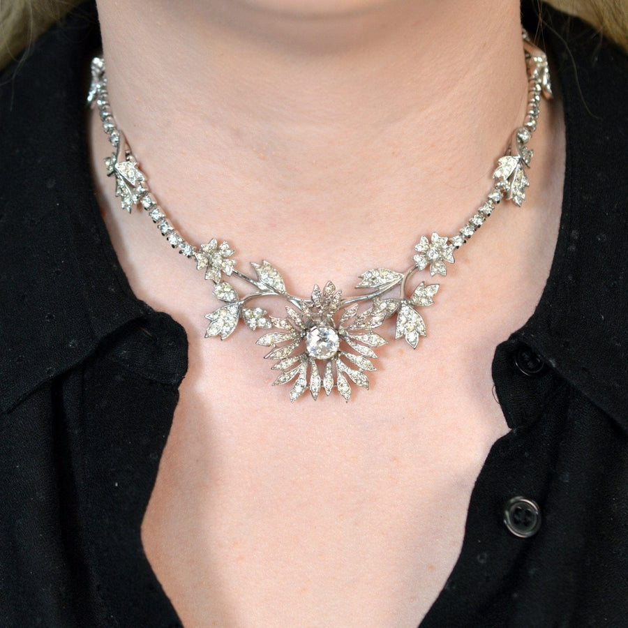 Vintage 1950s Kramer of New York necklace with rhinestones, floral design in silver-tone metal.