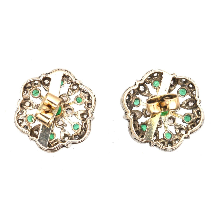 Large 1950s 18ct gold emerald and diamond cluster stud earrings with floral design.