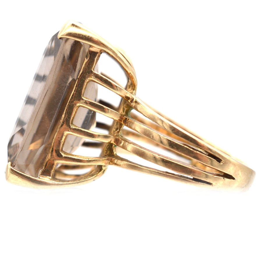 Large mid-century 9ct gold smoky quartz cocktail ring with an openwork shank, showcasing vintage elegance.