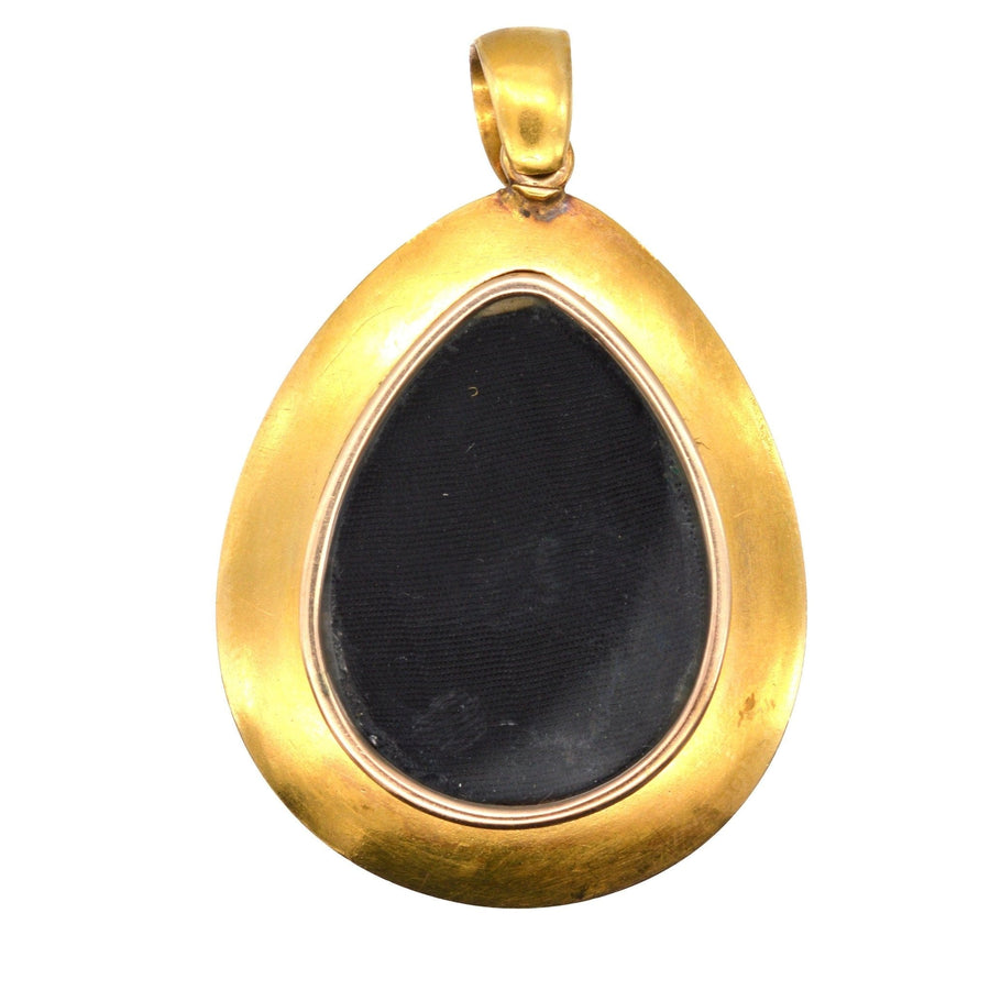 Antique gold locket pendant in teardrop shape, ideal for a personal photo or keepsake.