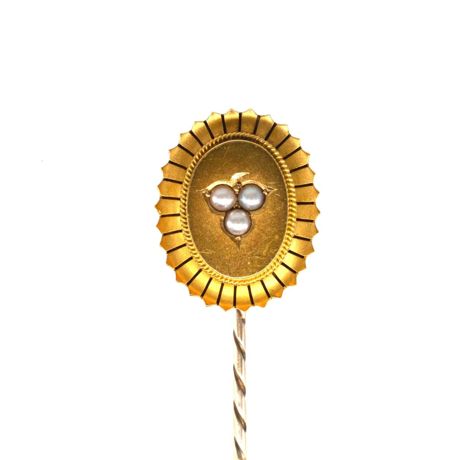 Large Victorian 15ct gold oval tie pin with split pearl leaf motif, featuring a trefoil design.