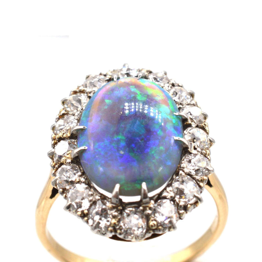 Large Victorian 18ct gold ring featuring a stunning black opal and diamond cluster.