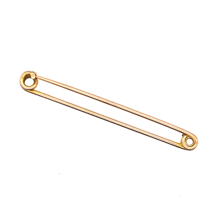 Large Victorian 9ct gold safety pin brooch, a historical accessory for horse riding and fashion.