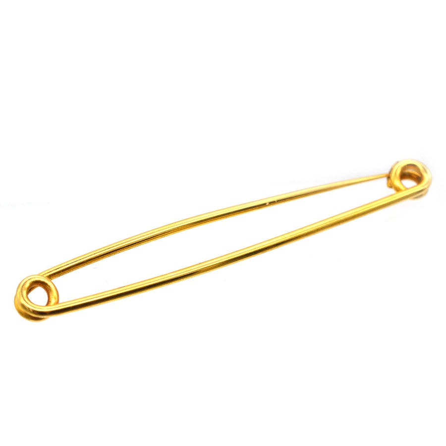 Large 9ct gold Victorian safety pin brooch, showcasing sleek design, used historically for fashion and practicality.