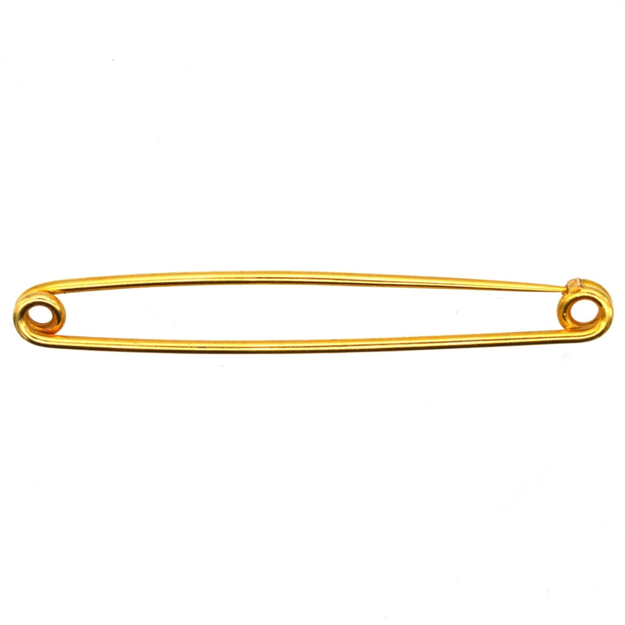 Large Victorian 9ct gold safety pin brooch, a classic piece used for fashion and practicality.