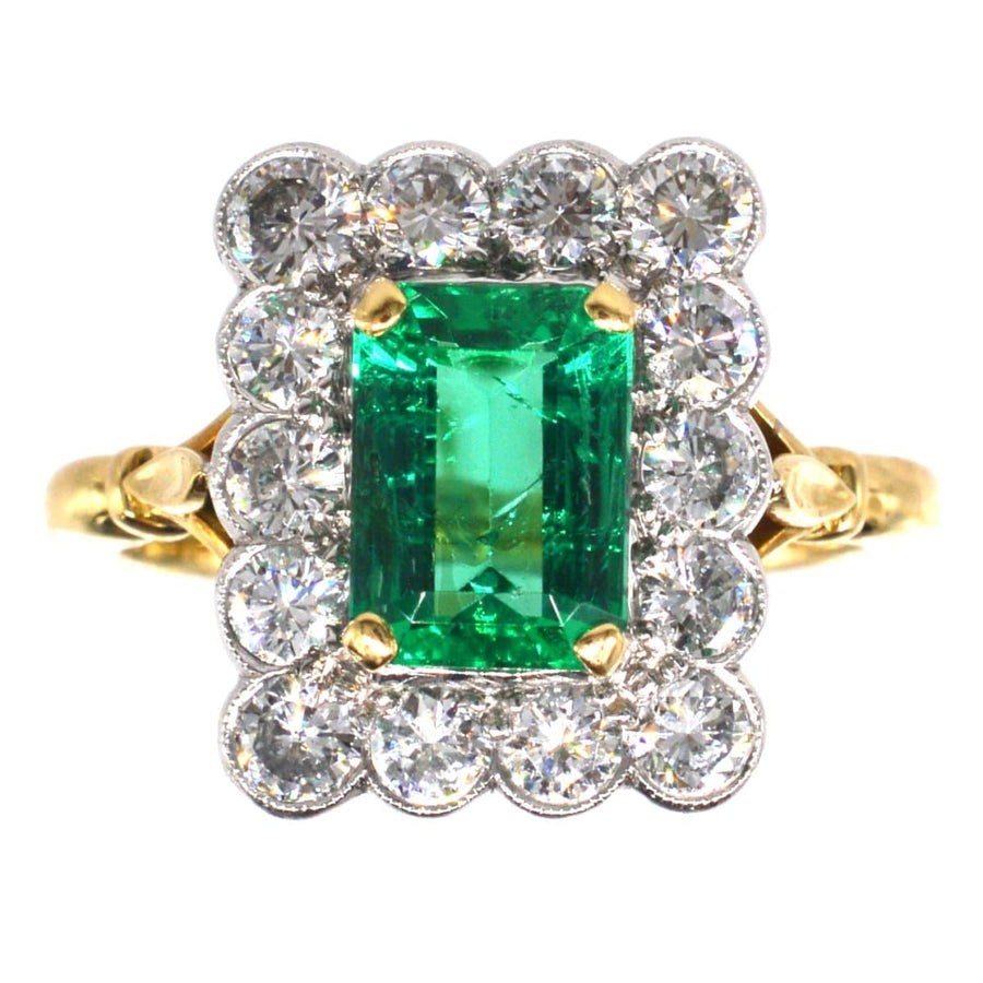 Large vintage 18ct gold and platinum emerald diamond cluster ring with 1.70 carat emerald and 1.50 carats of diamonds.