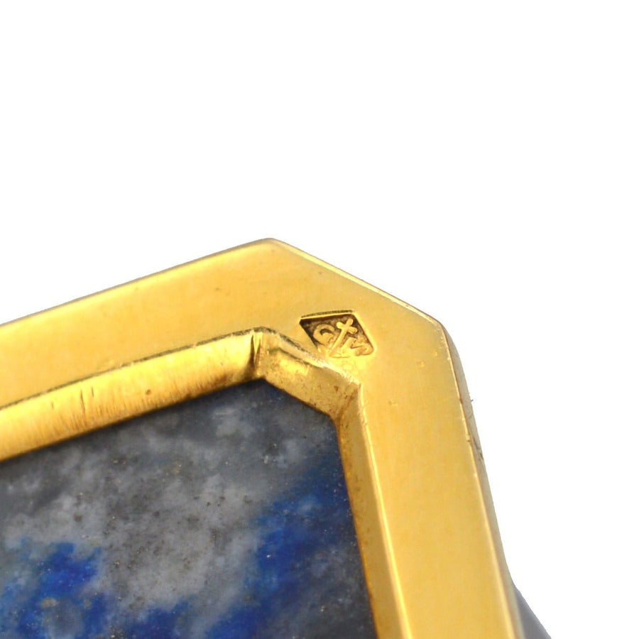 Close-up of late 1960s French 18ct gold and lapis lazuli clock case by de Brysal showing craftsmanship and hallmark.