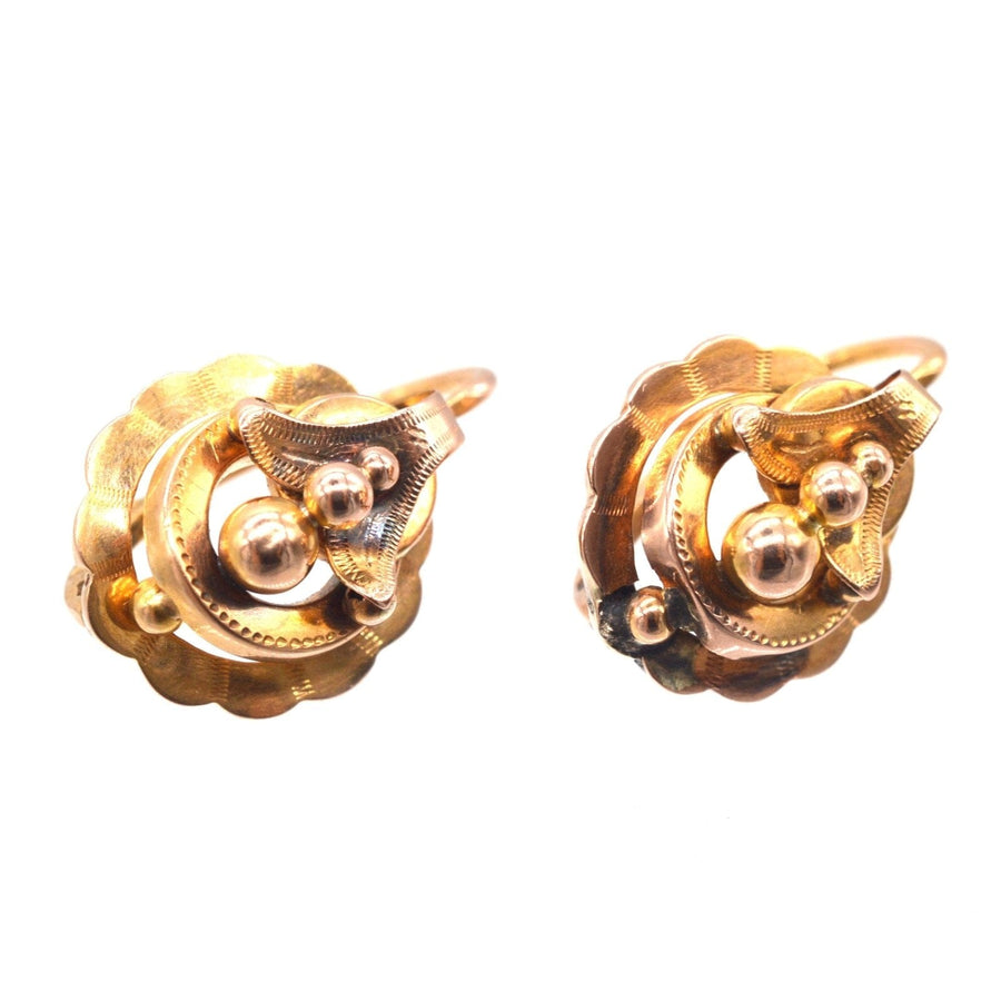 French 19th Century 18ct gold mini hoop Dormeuses earrings, featuring a unique floral design and hinge back fitting.