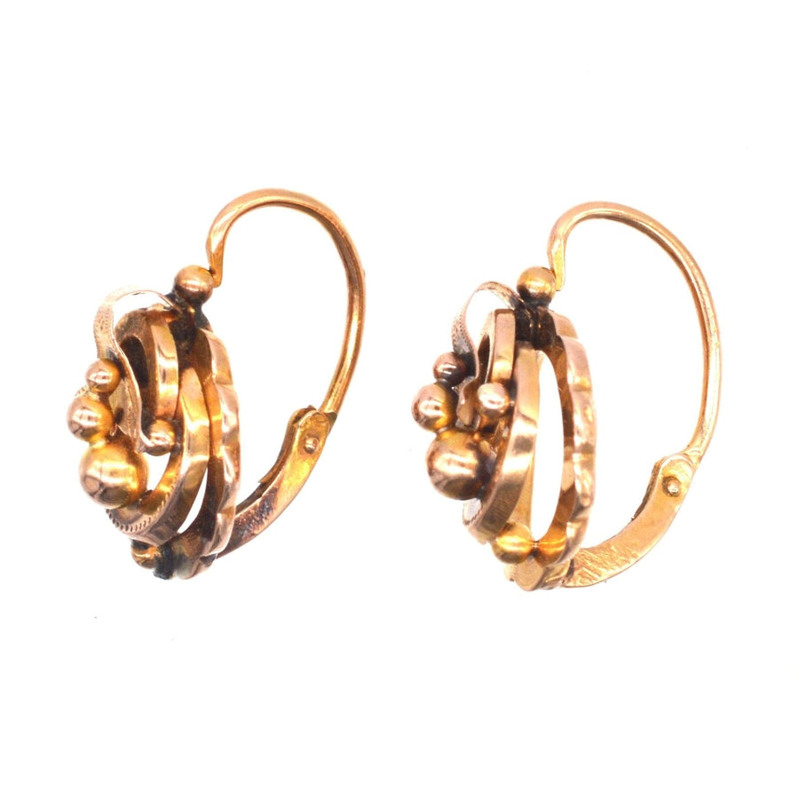 19th Century 18ct gold mini hoop "Dormeuses" earrings with intricate design and hinge back fitting.