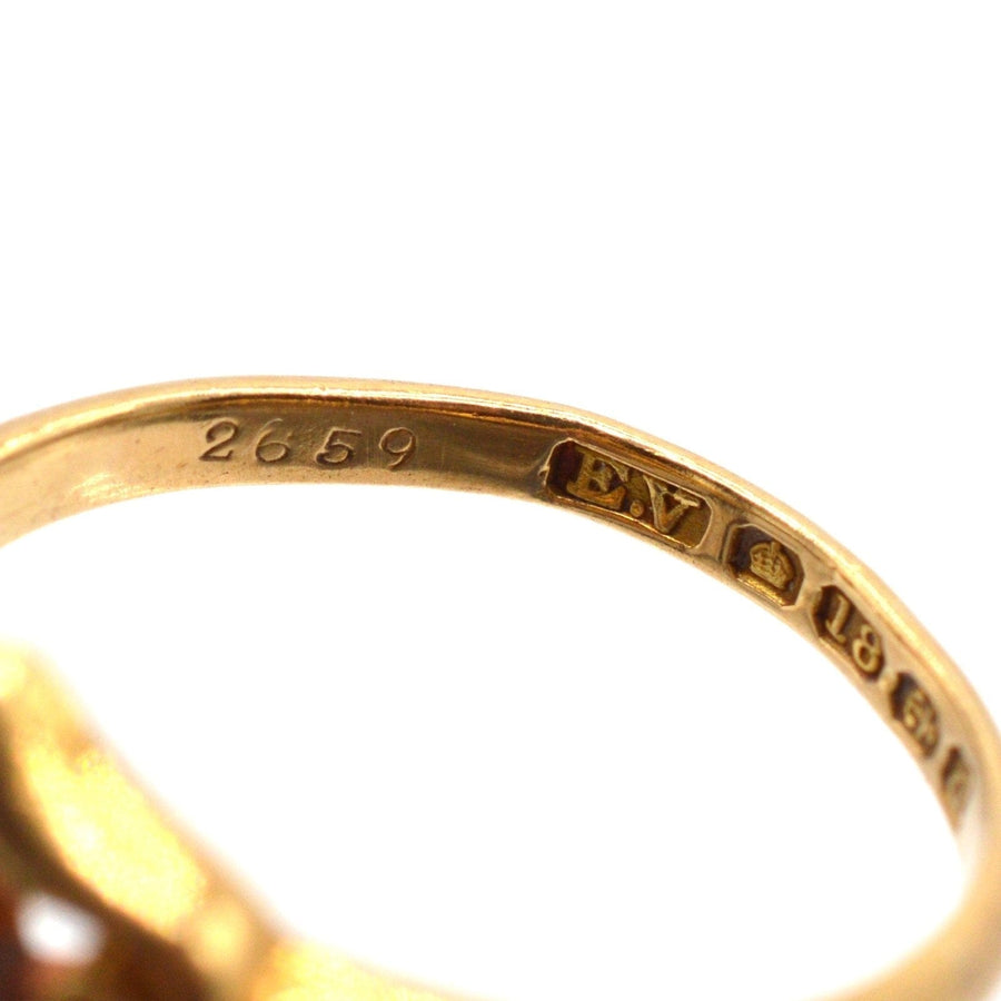 Late Victorian 18ct gold ring hallmark showing Birmingham 1900 date and intricate details.