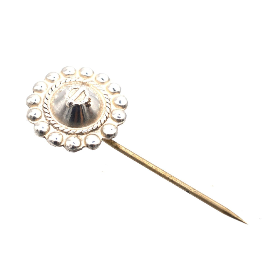 Late Victorian silver tie pin with circular design and polished finish, perfect for enhancing colorful silk ties.