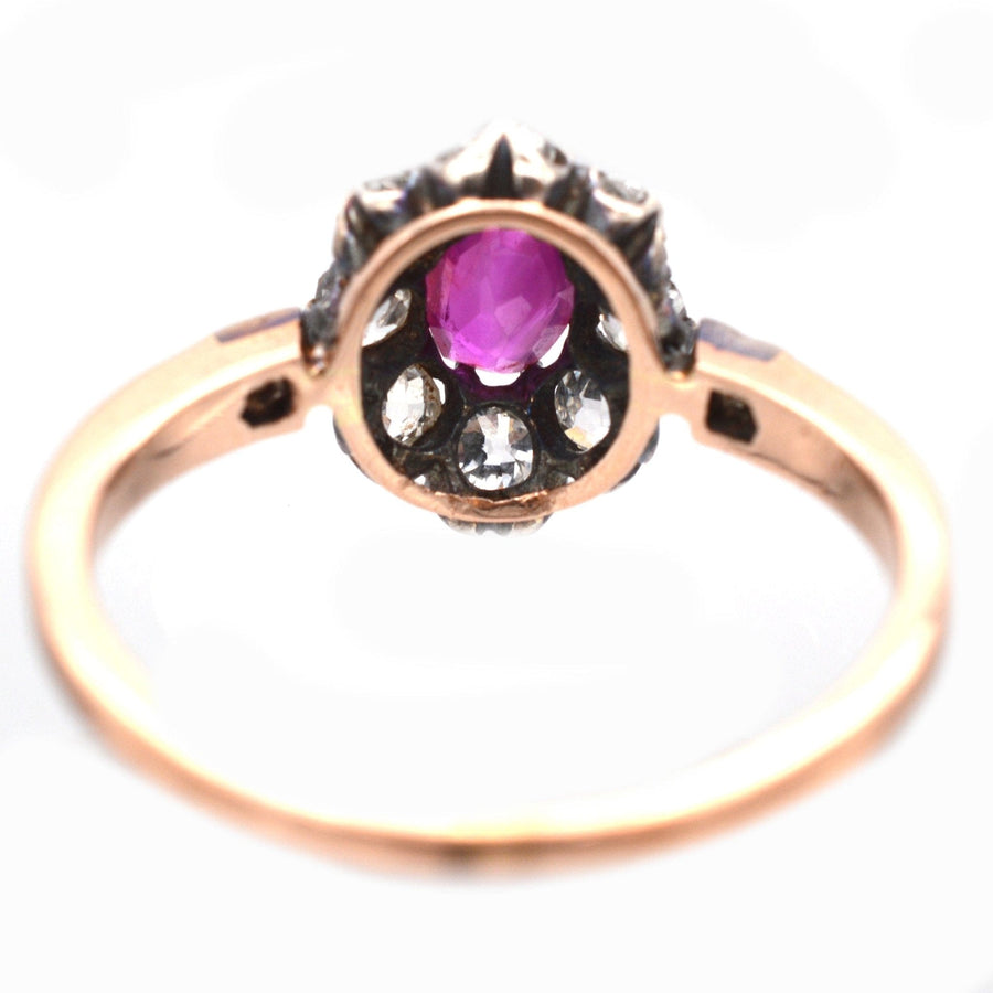 Late Victorian 15ct rose gold ring featuring a Burma ruby and old mine cut diamonds in a cluster design.