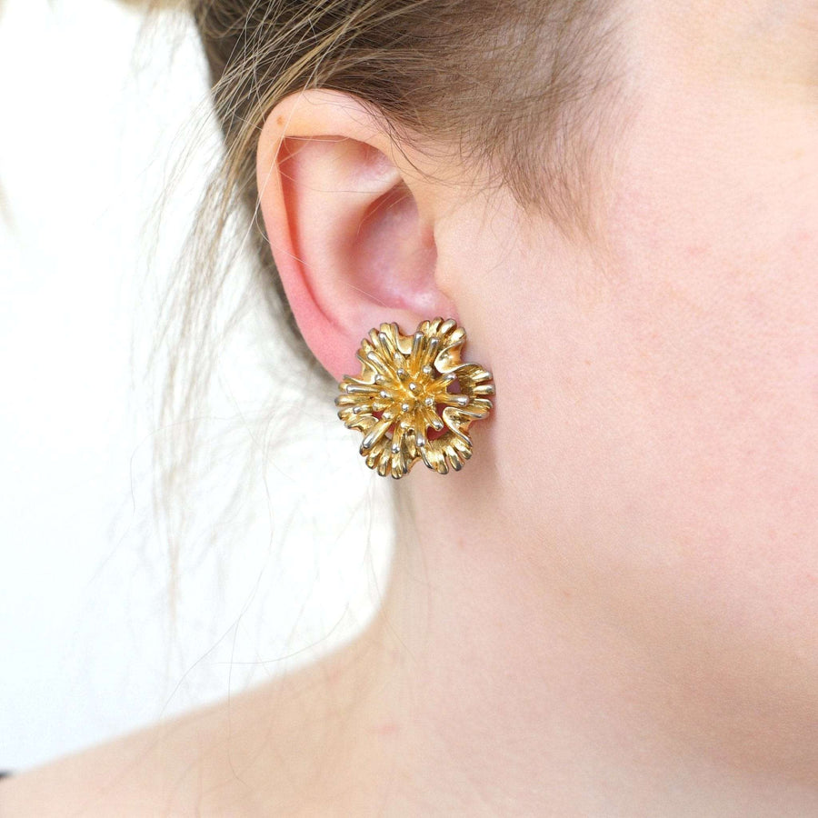 1960s gold floral clip-on earrings by Marcel Boucher, showcasing vintage elegance and comfort.