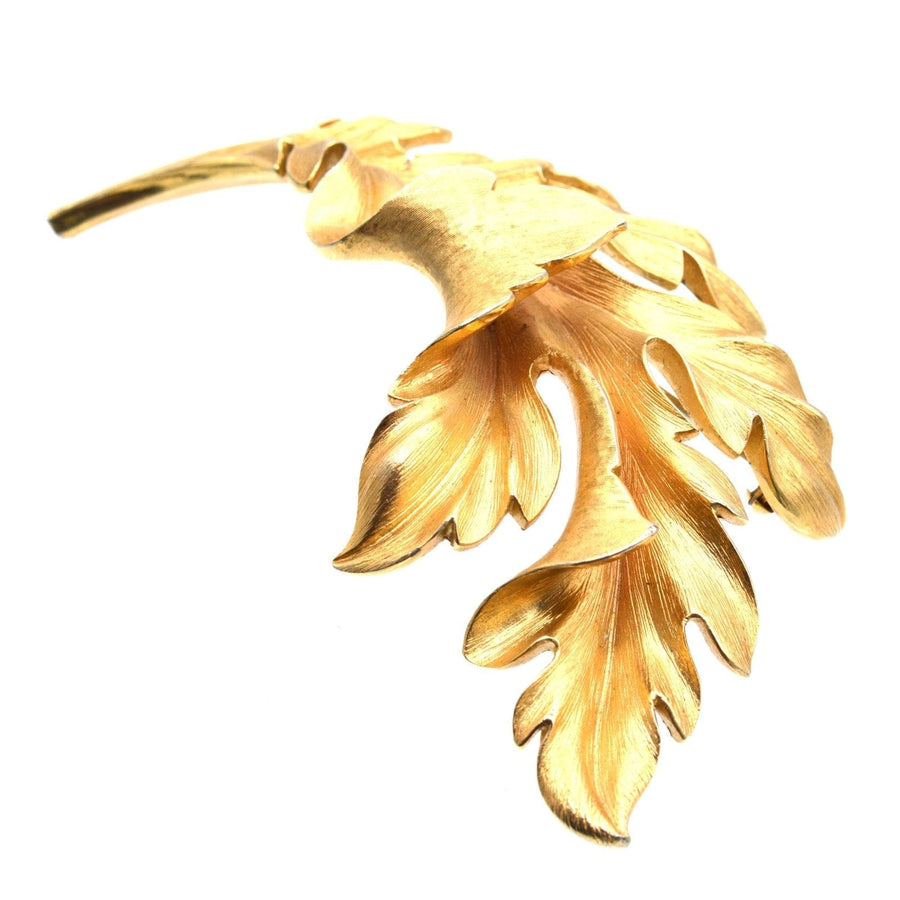 Mid Century Trifari large gilt metal leaf brooch with detailed leaf design, perfect statement jewelry piece.