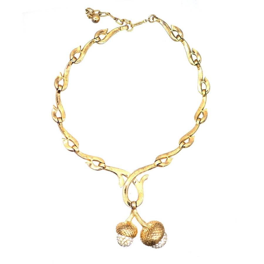Mid-century gold-tone statement necklace with stylized oak branches and rhinestone acorns, vintage 1950s.