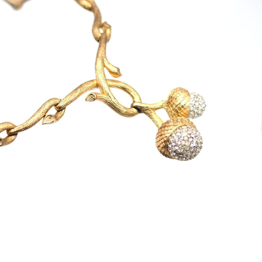 Gold-tone Trifari necklace with stylized oak branches and two sparkling acorn charms from the 1950s.